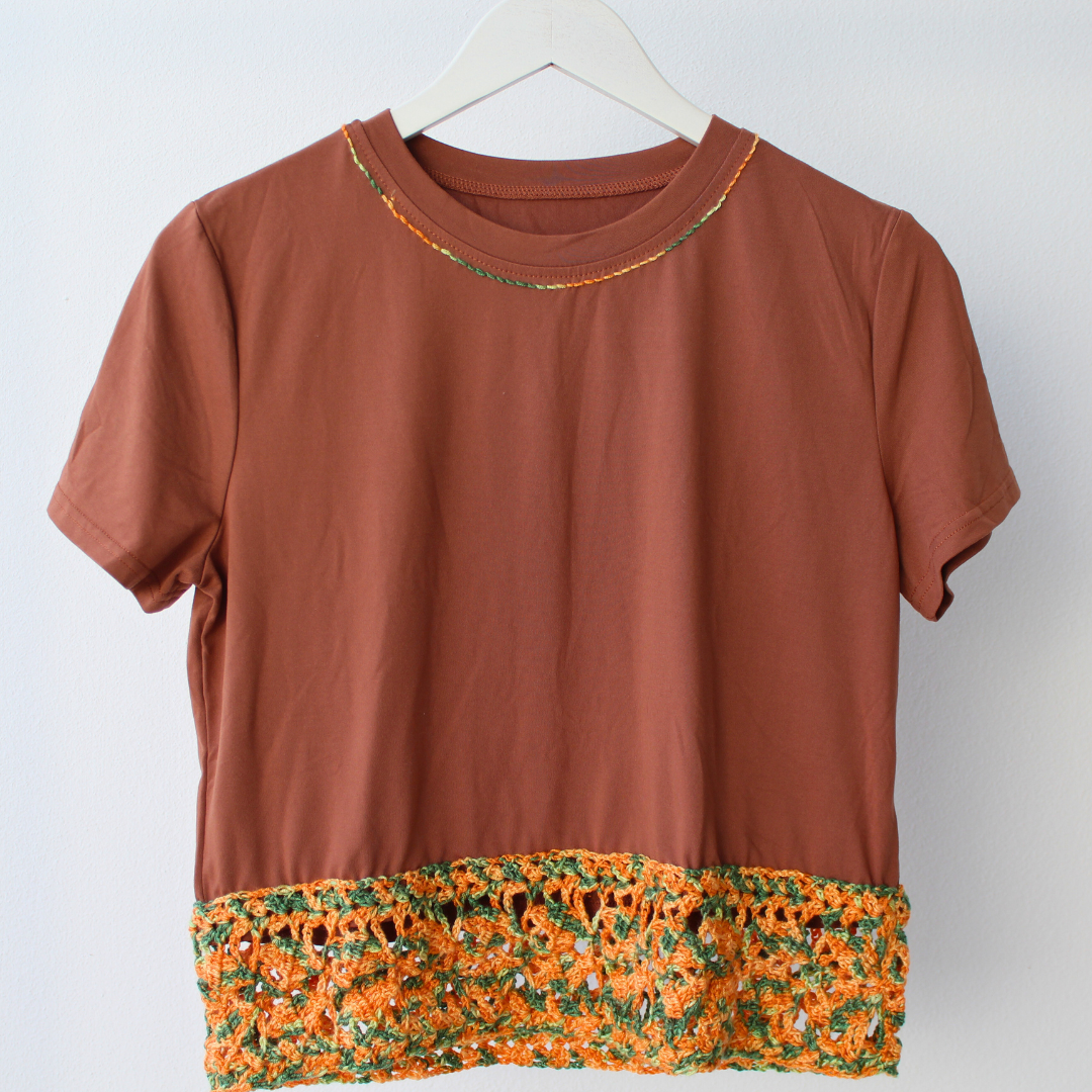 T-shirt with orange crochet appliqué