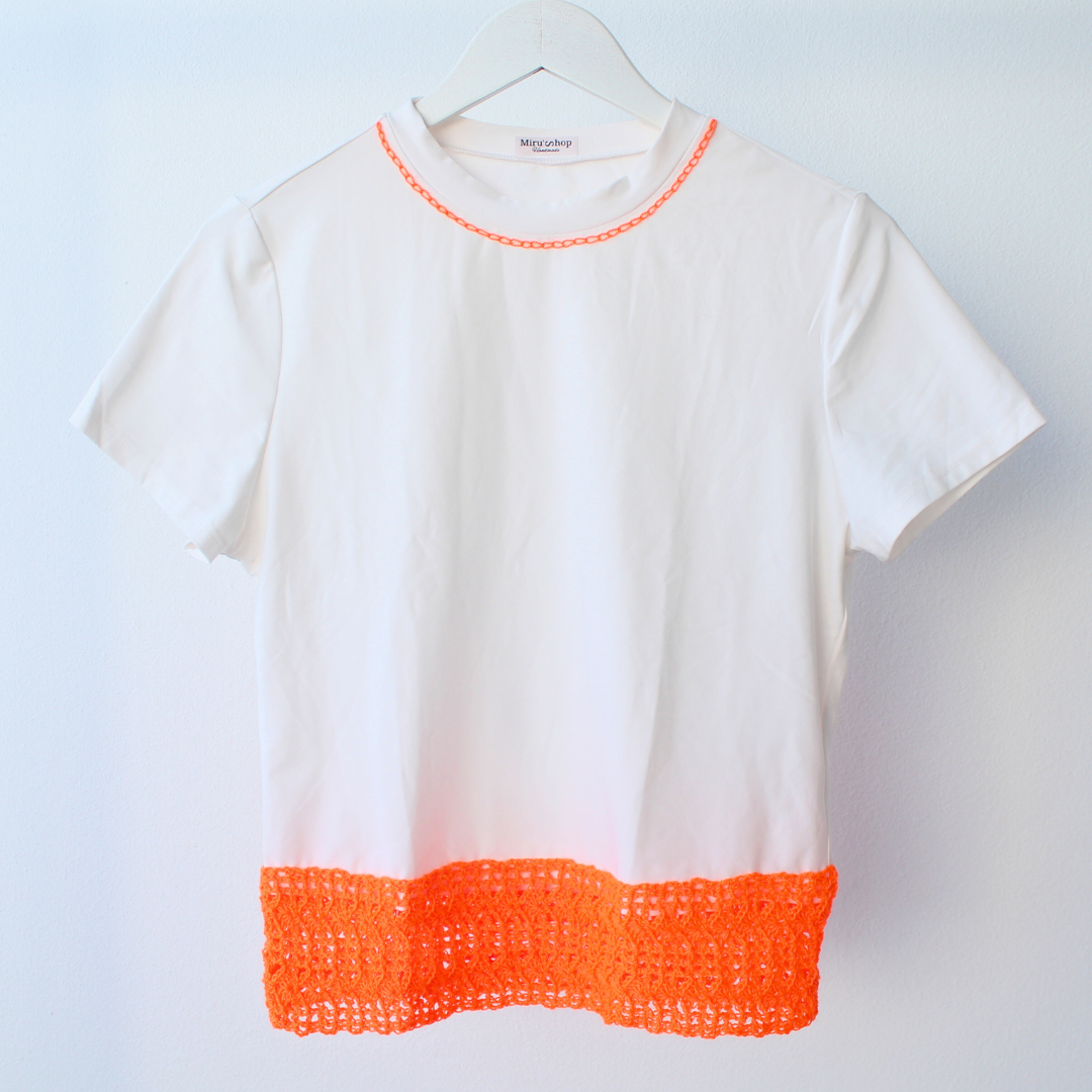 T-shirt with orange crochet appliqué