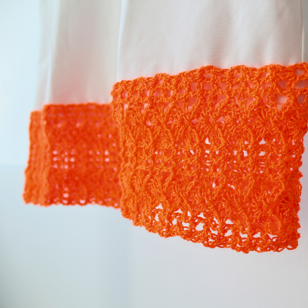 T-shirt with orange crochet appliqué