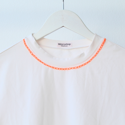 T-shirt with orange crochet appliqué